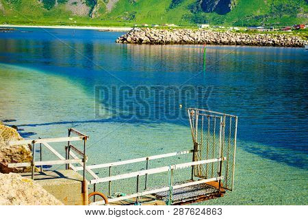 Fishing Port Old Pier And Gate With Bleik Village Houses In The Background. Andoya Island, Vesterale