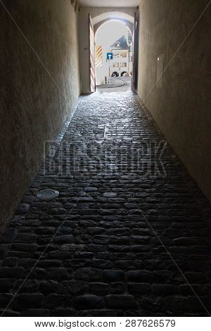 Public Passage Through An Old Stone Corridor That Leads To The Town Of Muret. Old Public Passage Fro