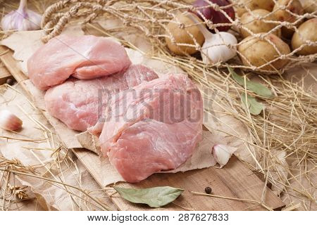 Raw Pork Meat - Carbonade, Fillet Or Loin. Fresh Meat And Ingredients. Rustic Style.