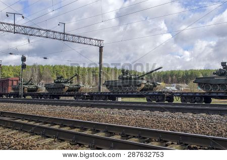 Russian Battle Tanks Loaded Onto A Cargo Railway Platform