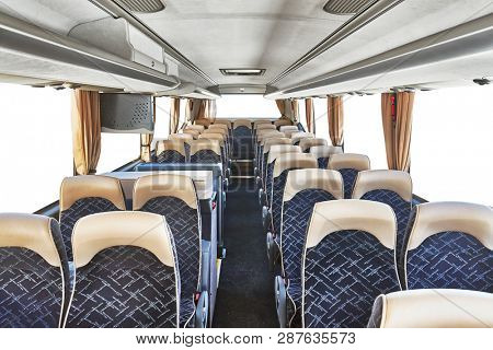 Bus interior empty seats, blanked out white windows