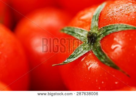 Fresh Cherry Tomatoes With Closeup. Background Red Tomatoes. Macro.