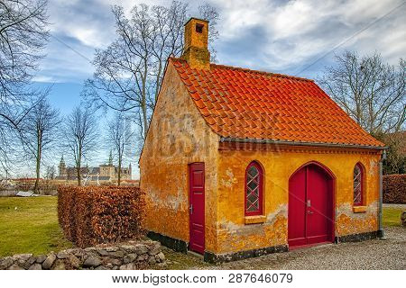 A Small House On The Courtyard Grounds Of The Church Of Saint Mary In The Old Town Of Helsingor In D