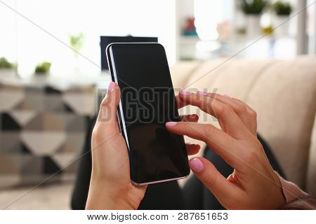 Minsk, Belarus - February 16, 2019 : Woman Holding Smartphone Samsung Galaxy S8 In Hand Illustrative