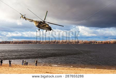 Samara, Russia - November 4, 2015: Russian Military Mi-8 Helicopter In Action Against Cloudy Sky And
