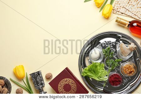 Flat Lay Composition With Symbolic Passover (pesach) Items And Meal On Color Background, Space For T