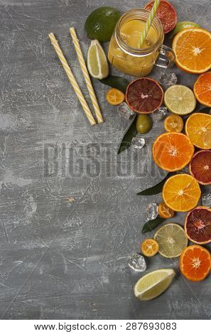 Citrus And Juice With Ice And Drinking Straw