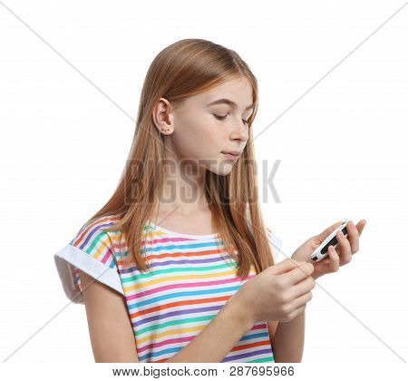 Teen Girl Using Glucometer On White Background. Diabetes Control