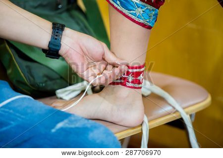 The Process Of Dressing The Thai Pantomime For The Actors With Hand Sewing, Repairing,