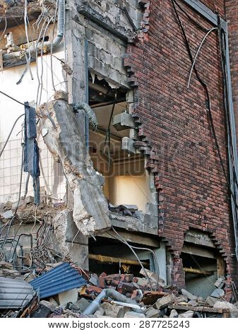 Full Frame Image Of A Wrecked Collapsing Building Being Demolished With Smashed Brick Walls And Rubb