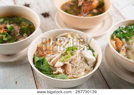 Various Southeast Asian dishes, noodles and soup.