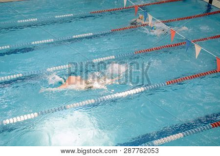 Swim In Swiming Pool. Closed Pool. Swim For Speed. Swimming Competition.