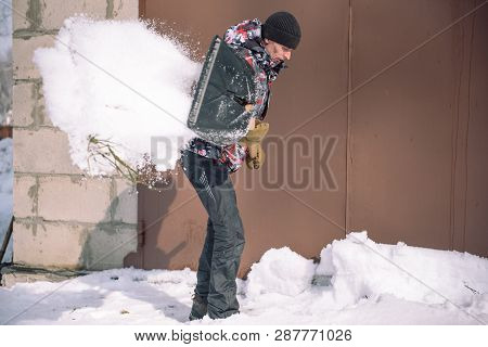 Clean The Snow With A Shovel. The Man Shovels Snow Shovels. Snow Shovel In Hand. Cleaning The Area I