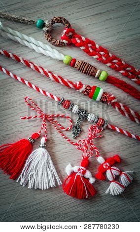Bulgarian Traditional Spring Decor Martenitsa Bracelets, Wooden Background. Baba Marta Holiday, Back