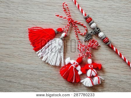 Bulgarian Traditional Spring Decor Martenitsa Bracelets, Wooden Background. Baba Marta Holiday, Back