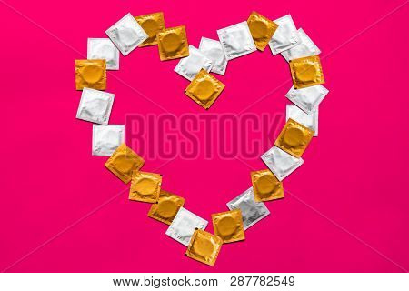 Condoms In Heart Shape, Top View. Large Amount Of Condoms, Shot From Above - Safe Sex And Contracept