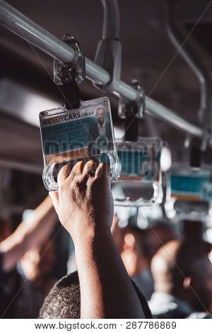 Johannesburg, South Africa, 28th February - 2019: Passengers Hands On Support Handles On Airport Tra
