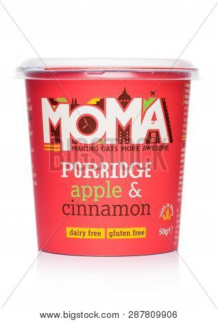 London, Uk - March 05, 2019: Cup Of Moma Porridge With Apple And Cinnamon On White Background.