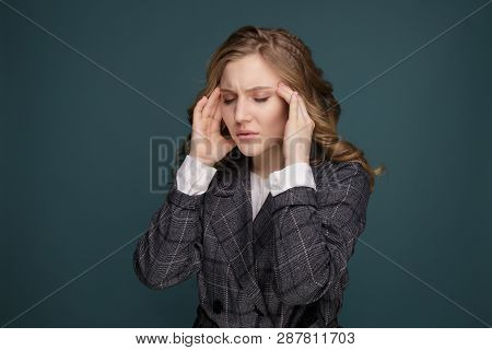 Health And Pain. Stressed Exhausted Young Woman Having Strong Tension Headache. Closeup Portrait Of 
