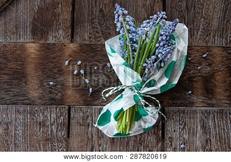 Bunch Of Blue Hyazinths On A Rustic Wooden Background