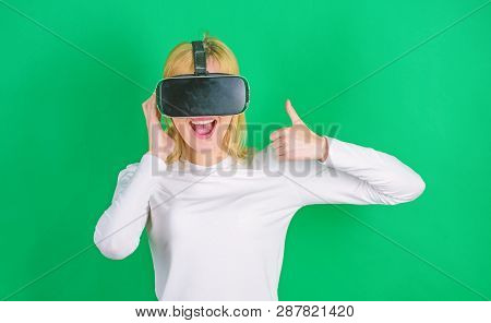 Woman With Virtual Reality Headset. Pretty Woman Playing Game In Virtual Reality Glasses. A Person I