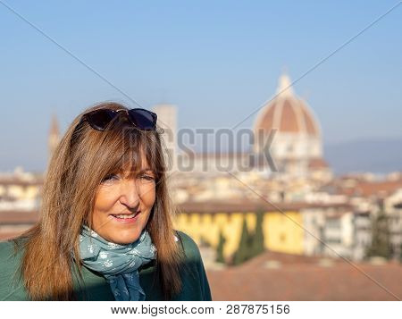 Mature And Beautiful Woman Poses On A Terrace And In Front Of The Florentine Cathedral, Santa Maria 