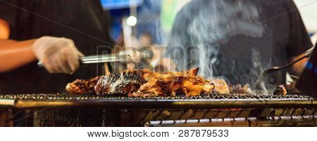 Traditional Thai Street Food, Beef Barbecue Grill On Outdoor Fireplace For Roasting Meat, Cooked Ove