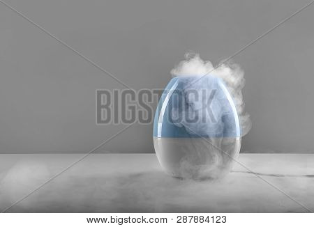 White-blue Air Humidifier. The Unique Design Quickly And Effectively Eliminates Dry Air, Providing A