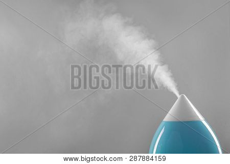 White-blue Air Humidifier. The Unique Design Quickly And Effectively Eliminates Dry Air, Providing A