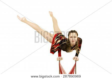 Flexible Equilibrist Performs Exercises On Acrobatic Walking Sticks.