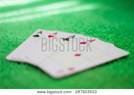 All Aces Exposed On A Green Table