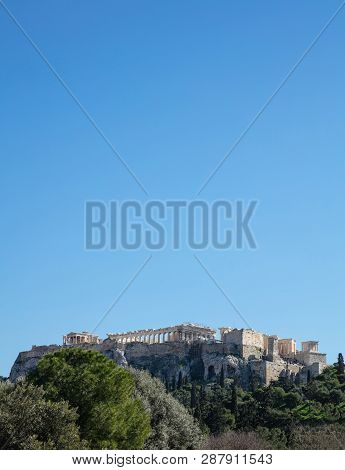 Acropolis Of Athens Greece Rock And Parthenon On Blue Sky Background, Sunny Day.