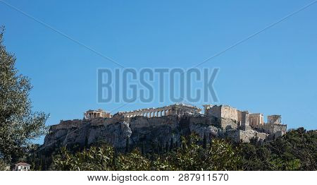 Acropolis Of Athens Greece Rock And Parthenon On Blue Sky Background, Sunny Day.
