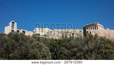 Acropolis Of Athens Greece Rock And Parthenon On Blue Sky Background, Sunny Day.