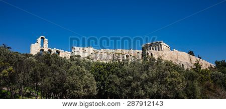 Acropolis Of Athens Greece Rock And Parthenon On Blue Sky Background, Sunny Day.