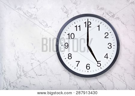 Wall Clock Show Five Oclock On White Marble Texture. Office Clock Show 5pm Or 5am