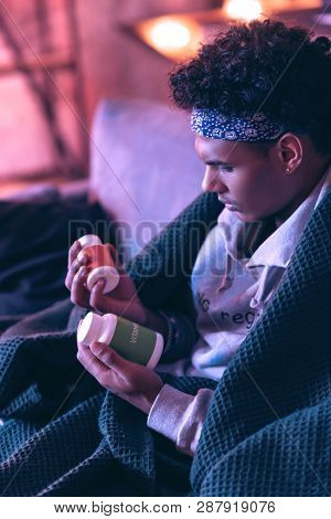 Confused Teenager Trying To Choose One Of The Medication, But He Failing With It.