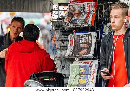 Strasbourg, France - Sep 12, 2017: Newspaper With Emmanuel Macron As Crowd Marching In Background Du