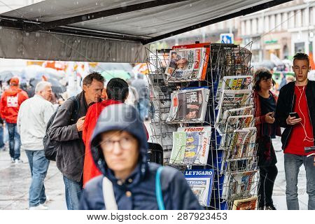Strasbourg, France - Sep 12, 2017: Newspaper With Emmanuel Macron As Crowd Marching In Background Du