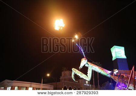 2/25/2019 Las Vegas, Nevada: Fire Breathing Music Playing Dancing Praying Mantis Sculpture on Freemont Street in Las Vegas Nevada. 
