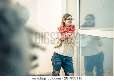 Good-looking Stylish Lady Staying With Cup Of Tea And Wearing Knitted Outfit