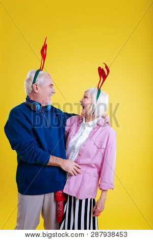 Pensioners Wearing Cute Deer Racks Making Christmas Photo