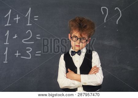 Brooding Boy Elementary School Student At The Blackboard