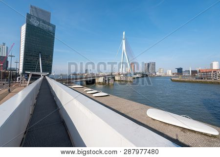 Rotterdam, Netherlands - March 26, 2016 : Erasmus Bridge And Kpn Tower Against Blue Sky And Sun