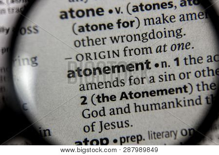 The Word Or Phrase Atonement In A Dictionary Book.