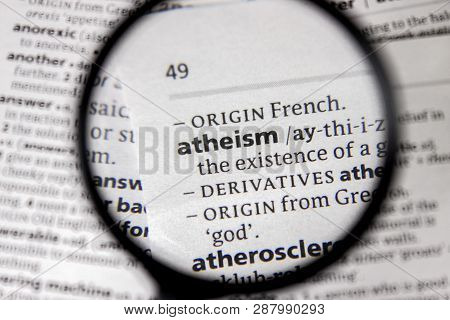 The Word Or Phrase Atheism In A Dictionary Book.