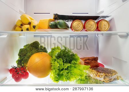 Fresh Food In The Fridge. Fruits, Vegetables, Beer, Cheese And Meat Into Coldstore