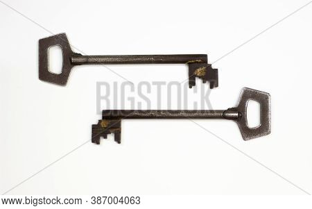 Old Key Isolated. Keys On Table. Ancient Keys, Used For Long Time. Vintage Key On White Background.