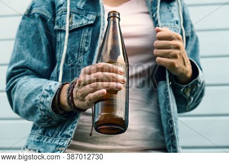 A Drunked Woman Dressed Punk, Informal Drinking Beer From A Brown Bottle, Alcohol Overdosage And Add