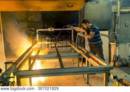 Plasma Sheet Metal Cutting Operator On A Rack